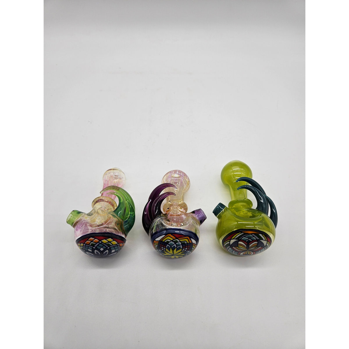 Freeekglass fume filla spoons in Purple Horns, Green Horns, and Limedrop.