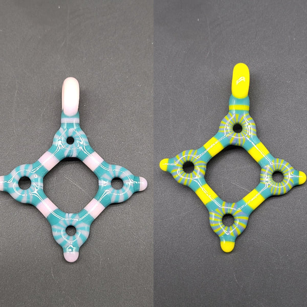 Kaja Glass circle tech diamond pendants.